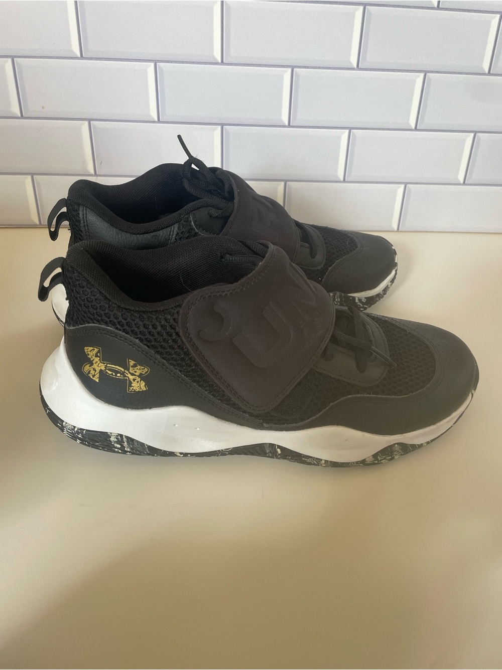 Under Armour Black Gold and White Kids' Slip-On Athletic Sneakers size 7Youth